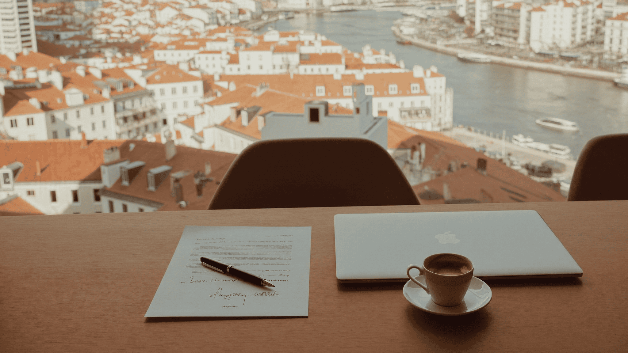 Signed power of attorney on a bright desk overlooking Lisbon rooftops